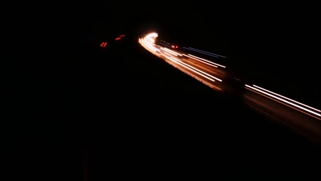 dynamic, long exposure motorway hyper lapse, busy road, freeway. light rails show a congested british motorway. nighttime, lights, dusk.