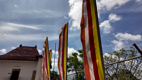 buddhist temple with flags in sri lanka