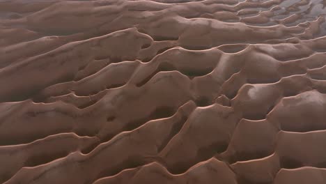 aerial view of sand dunes and tidal flats