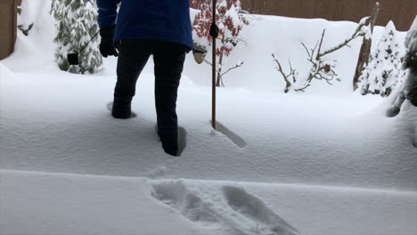 woman walking in deep snow