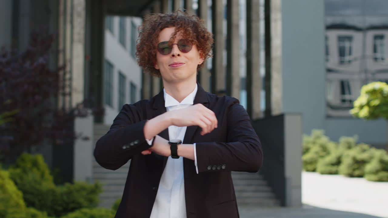 Smart looking young businessman in suit smile to camera showing confident ready for big day at work