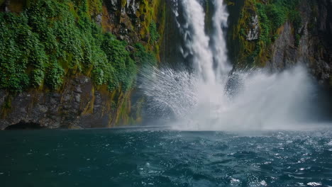 majestic waterfall cascading into a blue lake