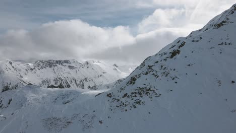 Revealing-SlowMotion-Panoramic-Drone-shot-of-the-Pirin-mountainpeaks,-in-Bulgaria