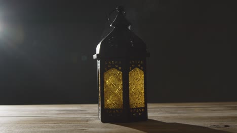 stationary shot of smoke pouring out of a lantern during ramadan celebrations