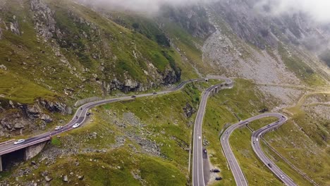 Beautiful-winding-road-in-the-heart-of-the-Carpathian-Mountains,-captured-with-a-drone