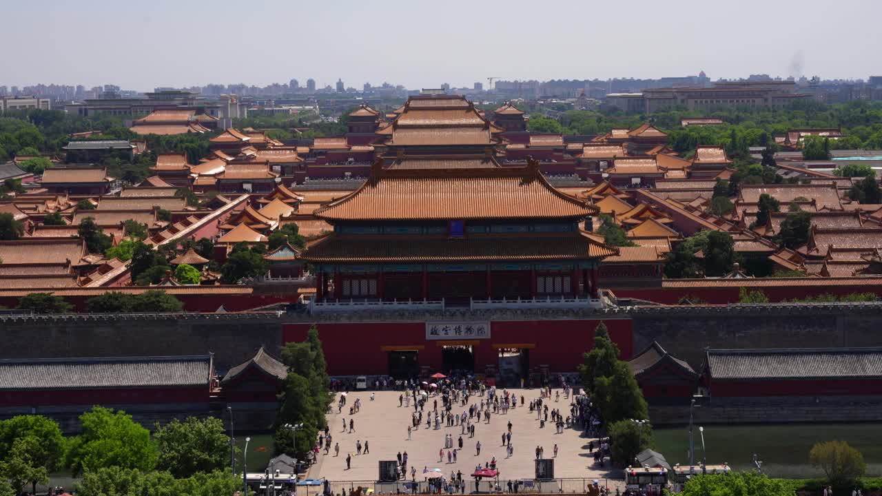 Beijing's Forbidden City with tourists, seen from Jingshan Park on a sunny day. Top down view
