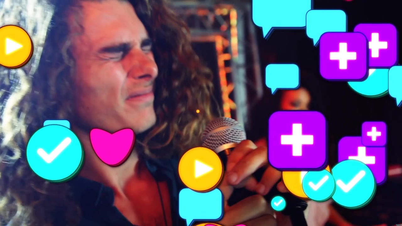Vertical video: Lead singer gripping mic, singing music on stage, sparking social icons over singer