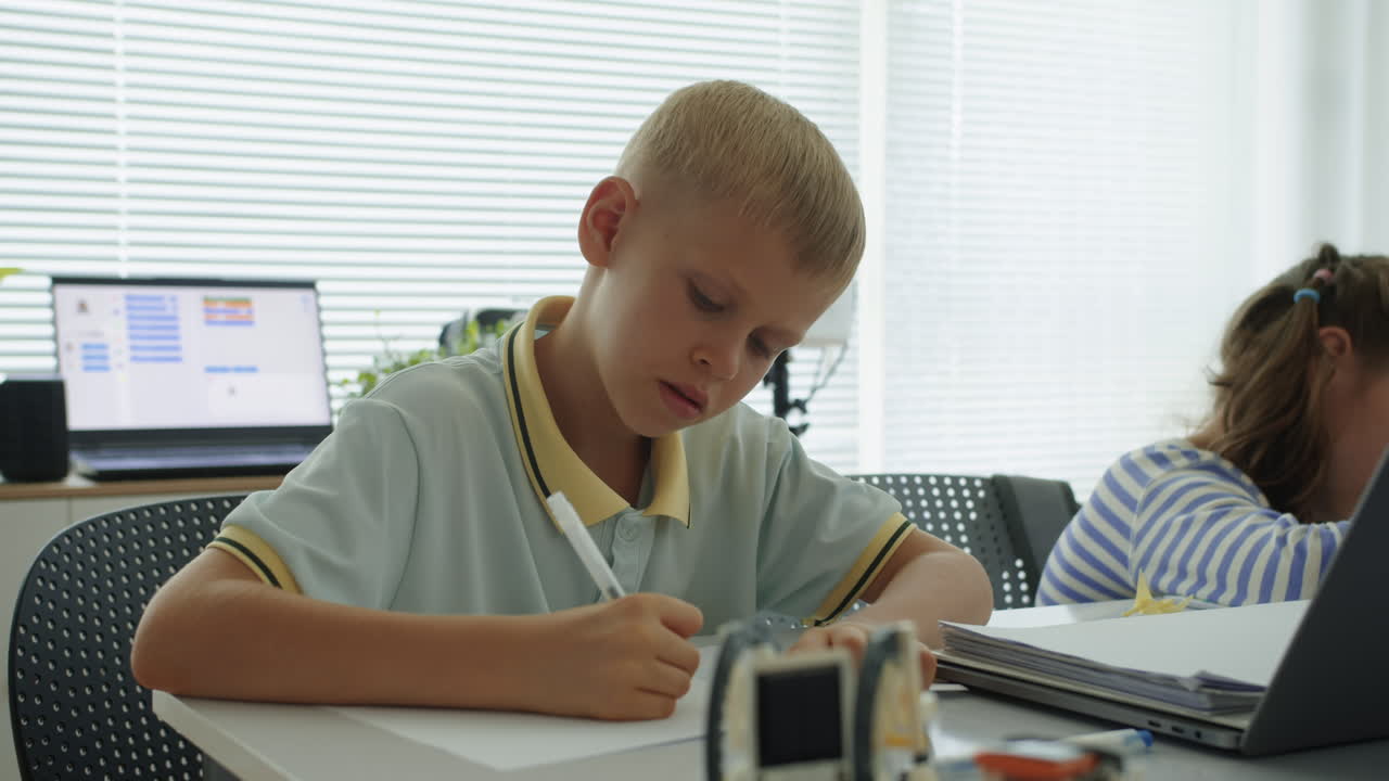 Portrait of Boy Doing Test at Computer Science Class