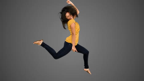 woman jumping on grey background