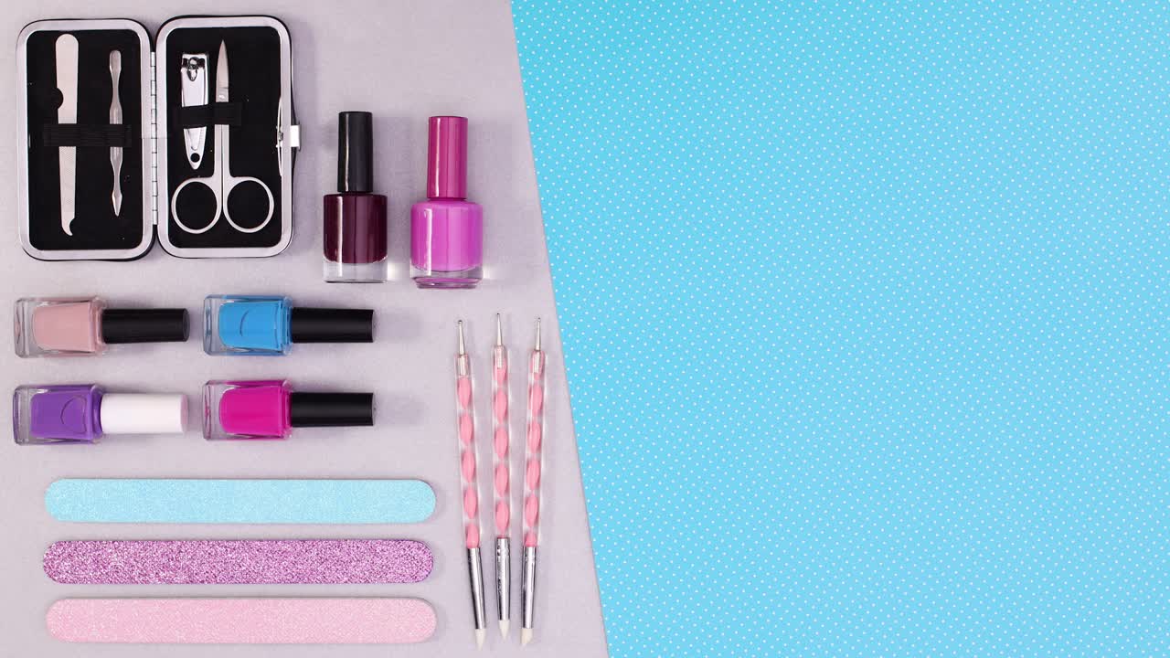 Manicure nail accessories and tools appear on left side. Stop motion