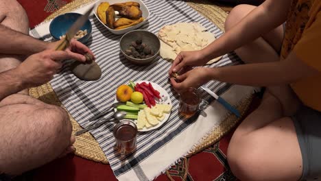 local food breakfast table cloth turkish kahvalti with olive black tea persian bread simple meal at home in rural town authentic food couple life in iran young family sexy relationship persian culture