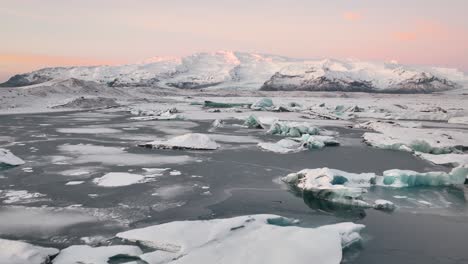 fly over icebergs in jokulsarlon glacier lagoon in vatnajokull national park, southeast iceland
