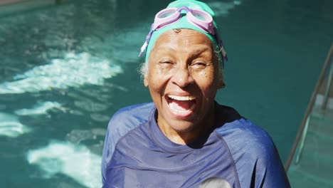 video of happy senior african american women swimming in pool