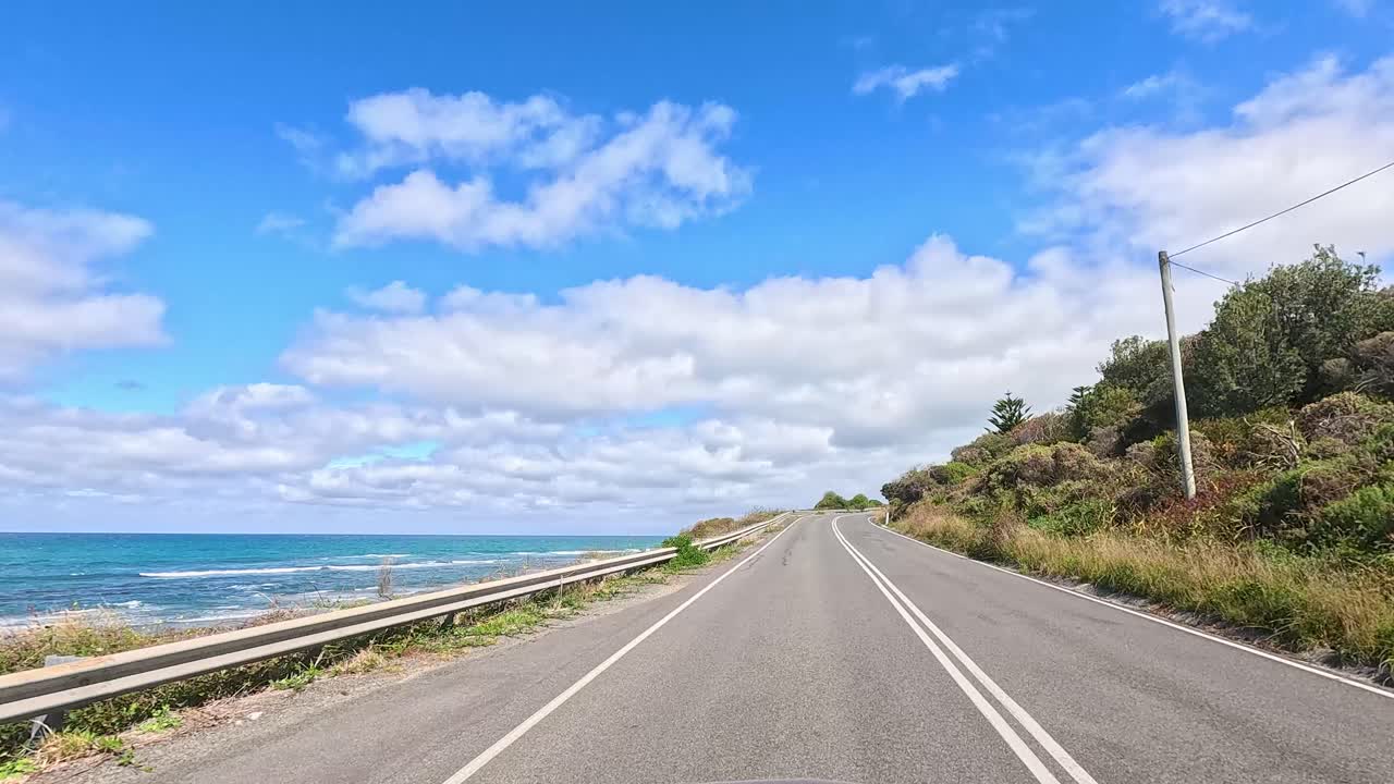 A 15-second video captures a sunny drive along the Great Ocean Road, showcasing coastal views and lush greenery