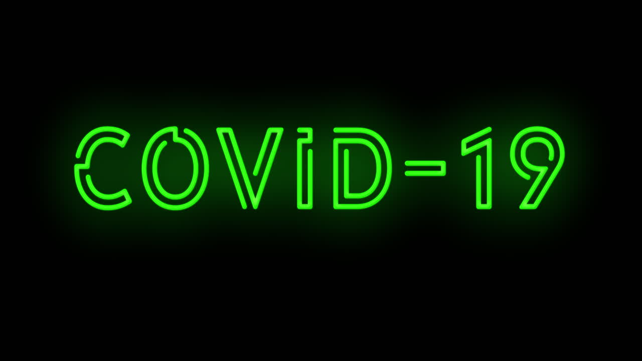Cartello verde lampeggiante "RESTA A CASA Covid-19 Coronavirus" che si accende e spegne con sfarfallio