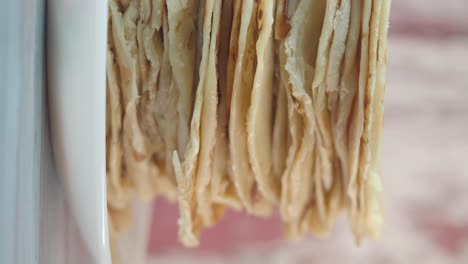 close-up of stacked thin flatbread or crepes