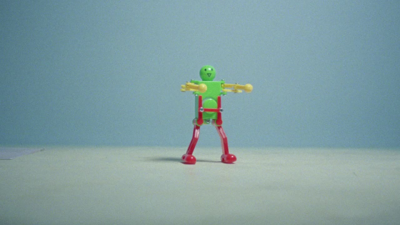 16mm film of dancing toy robot