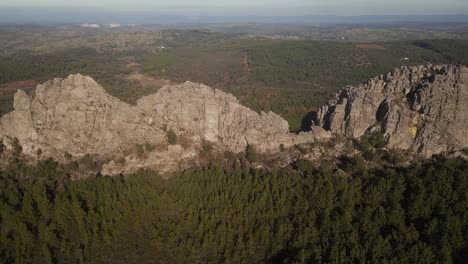 Rocky-and-green-valley-mountains,-aerial-view