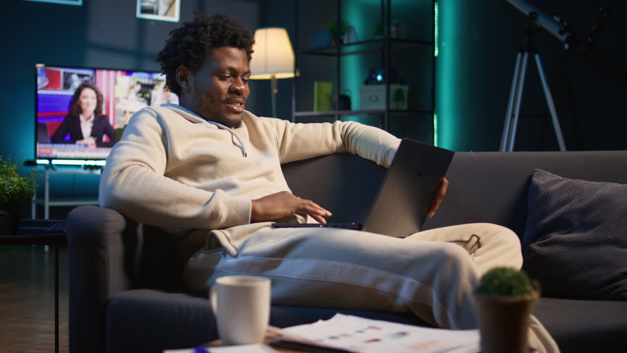 Home office user actively participating in a teleconference for remote workshop, maintaining a strong digital connection for effective online course. Man joining virtual call connection. Camera B.