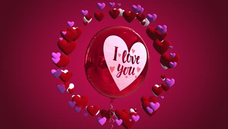 high quality seasonal motion graphic celebrating st valentine's day, with pink and red color scheme, balloon and a circle of spinning love hearts - with the message "i love you