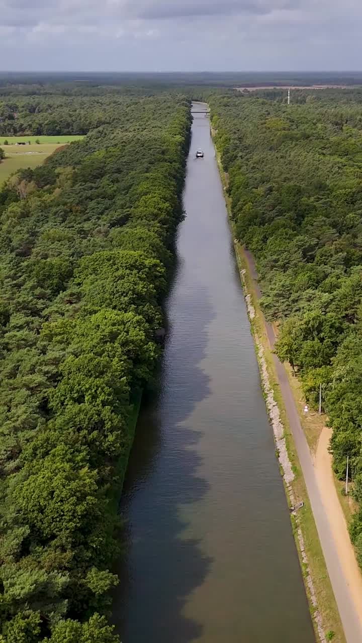 Aerial view of a canal surrounded by forest