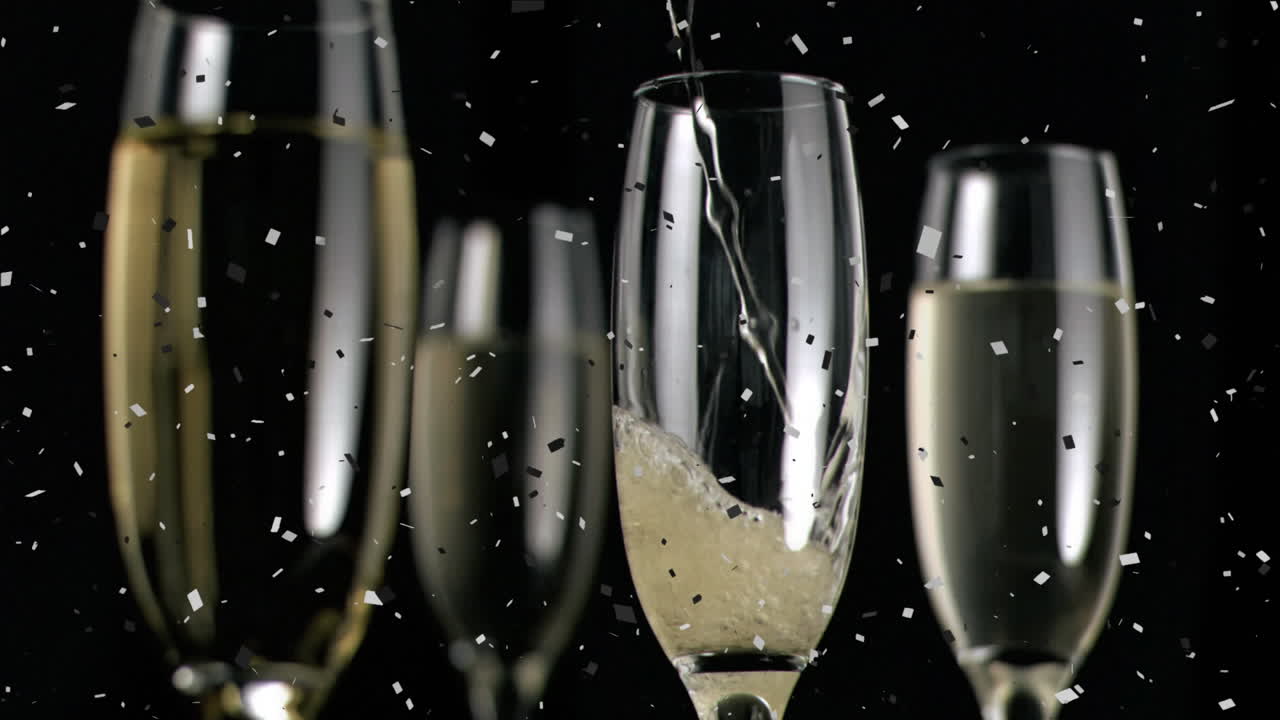 Animazione di bicchieri da champagne e champagne che viene versato, con coriandoli che cadono su sfondo nero