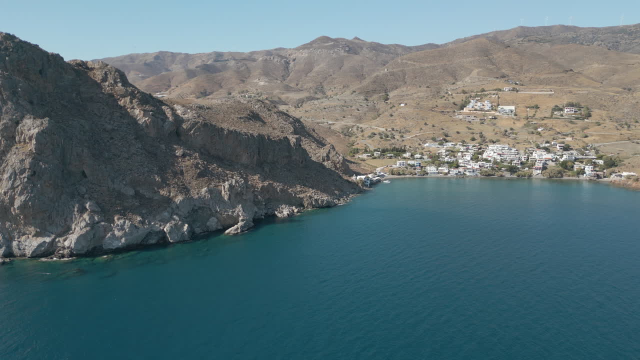 Rocky Cliffs At Edge Of Lentas Village Pushing Into The Sea 4K 60FPS