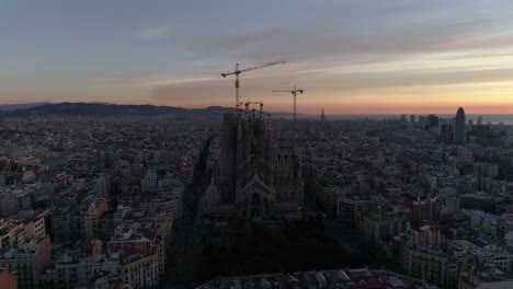 cathedral of sagrada familia on barcelona surrounded by other buildings