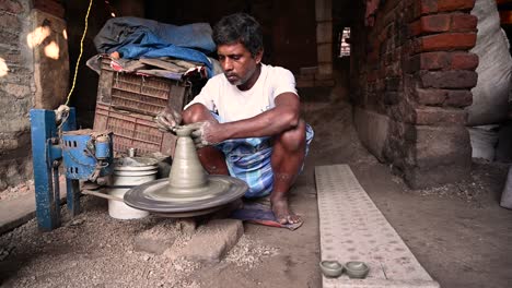 traditional diya made of clay and mud placed in sunlight at diya factory in rural india.