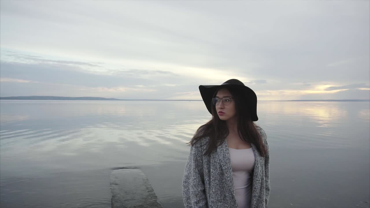 Woman by the Lakeside at Sunset