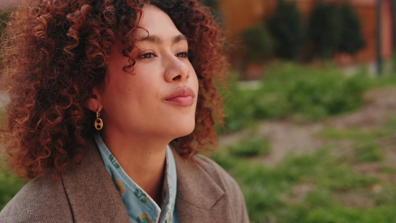 Young Woman Enjoying a Coffee Break Outdoors