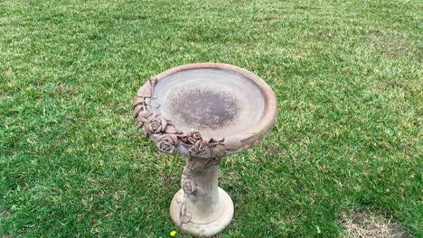 Video-of-rain-falling-into-a-fountain-and-making-ripples-in-the-standing-water-filled-from-the-earlier-rainfall