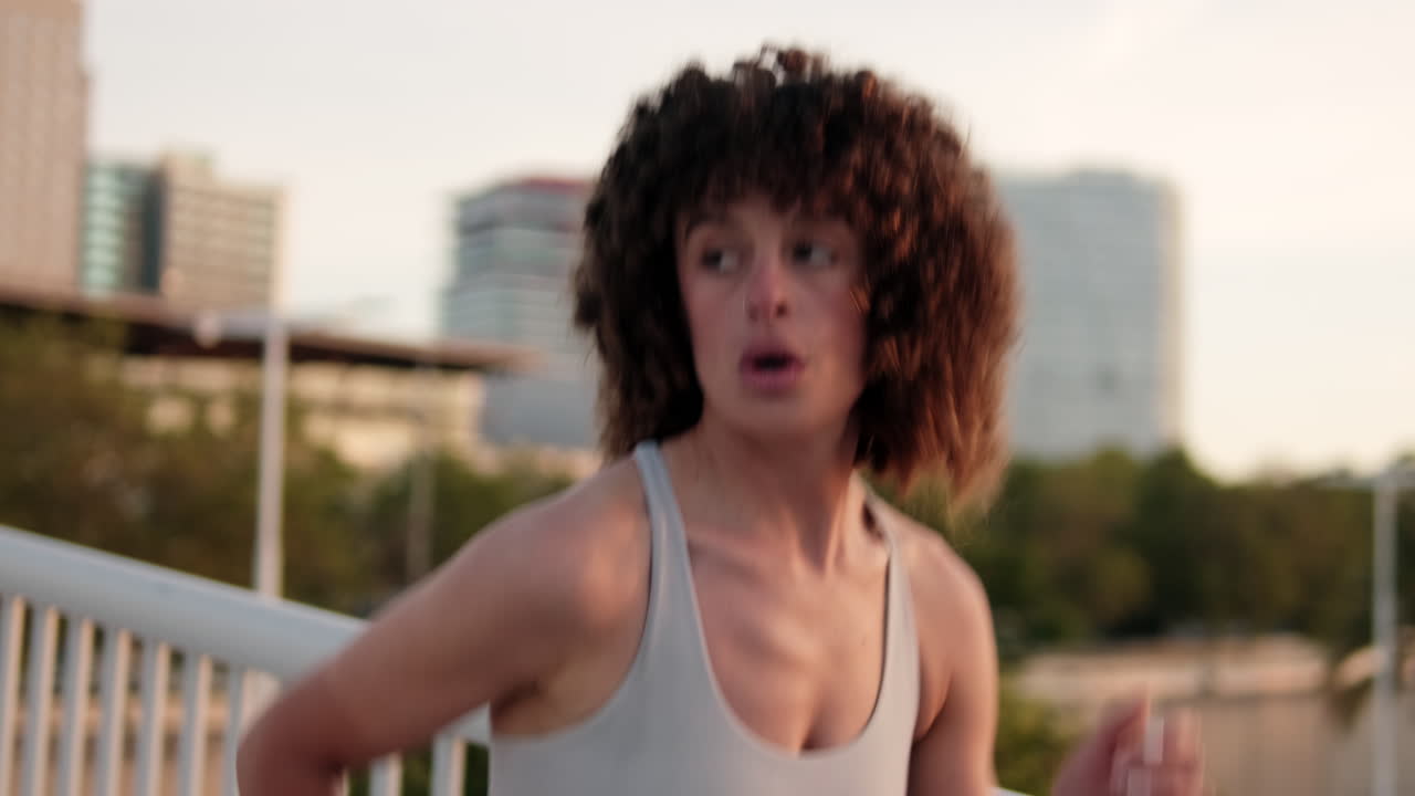 Woman Jogging and Checking Smartwatch