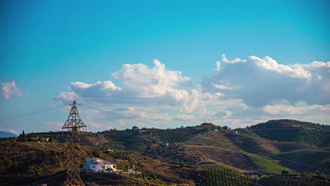 time-lapse of rural area power grid and moving clouds in countryside of spain