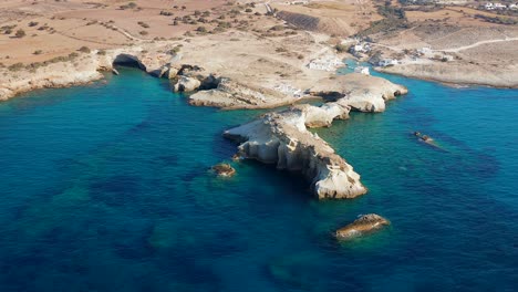 milos island coastline aerial reveal push back, greek island