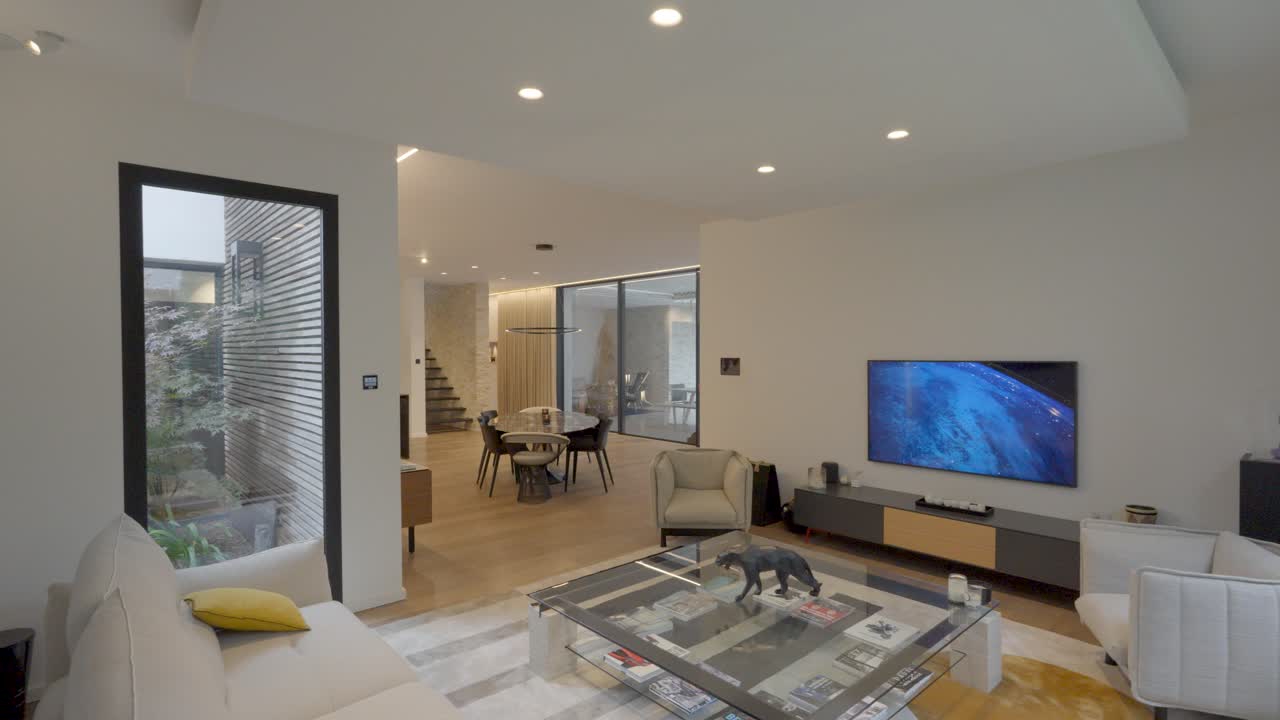 Sensor lighting in modern open-concept living room with bright decor and a cozy atmosphere