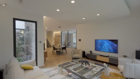 sensor lighting in modern open-concept living room with bright decor and a cozy atmosphere