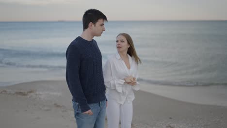 couple arguing on the beach