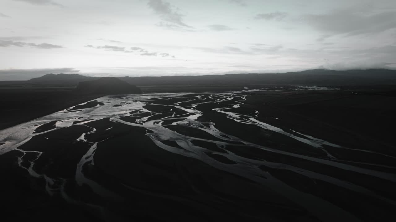 aerial thor valley, glacial river flowing through black volcanic floodplain, thorsm&ouml;rk landscape national park Iceland