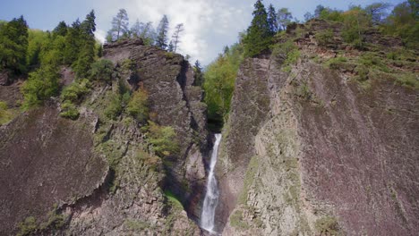 waterfall between huge rocks