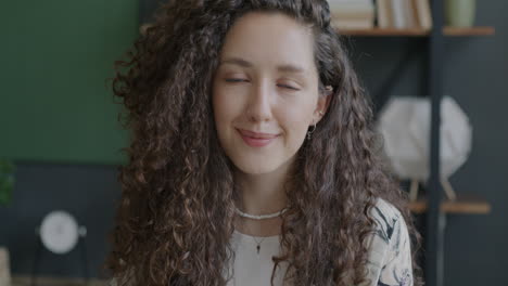 smiling woman with curly hair