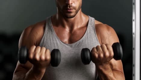 man lifting dumbbells