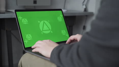 laptop with green screen chroma. mockup. telecommuting, sending and receiving messages. close-up.