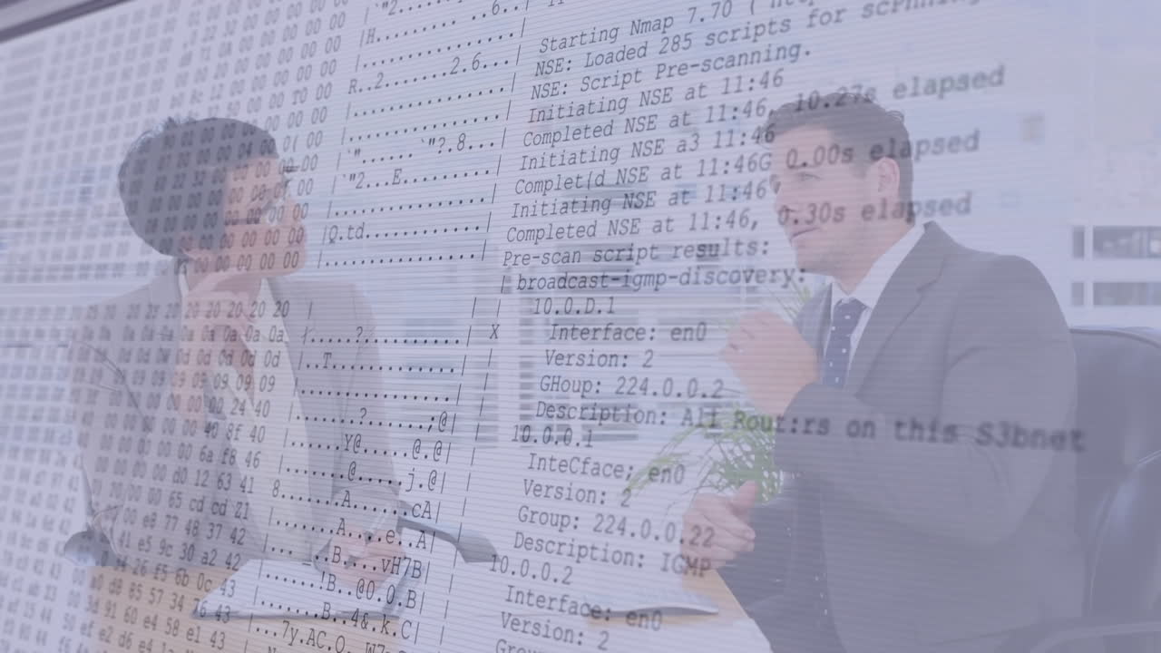 Discussing computer code, business professionals with animation of network data in office