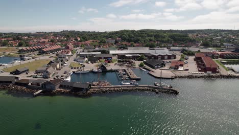 drone view of a marina and a costal town in denmark countryside