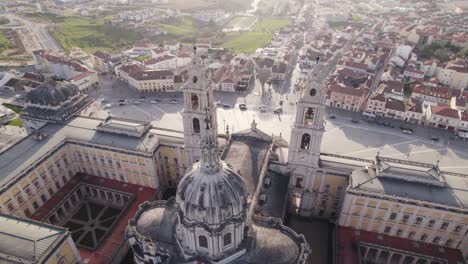 Aerial-orbit-close-up-tower-of-the-famous-landmark-cathedral-in-Mafra,-Portugal