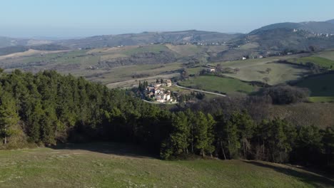 Italian-village-behind-forrest-revealing