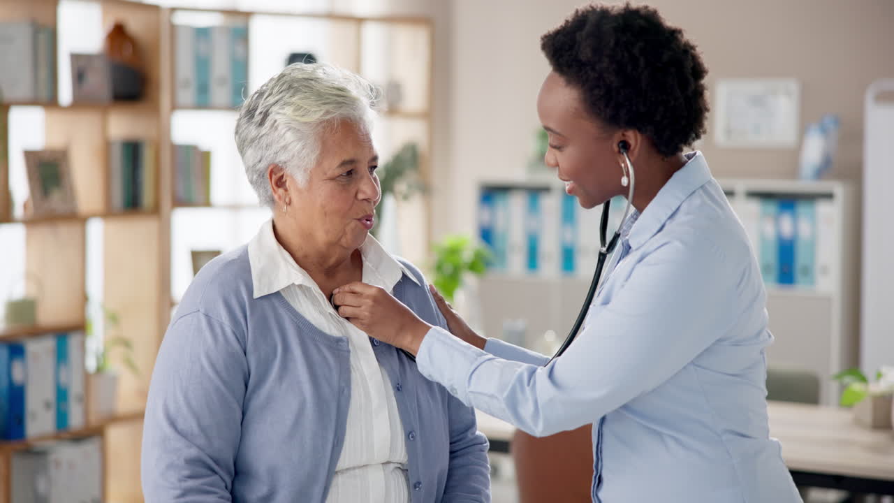 Doctor examining senior patient with stethoscope