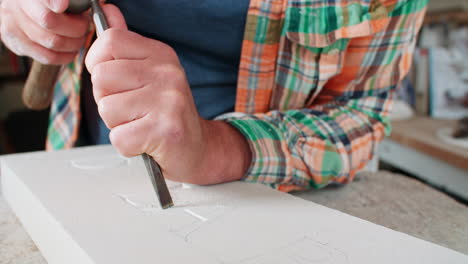 Slow-Motion-Shot-Of-Stone-Mason-At-Work-On-Carving-In-Studio