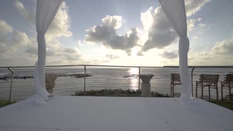 a wide shot of a wedding hall by the sea